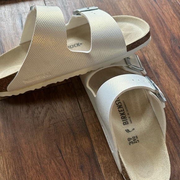 Birkenstock White Sandals with Silver Buckles - Picture 2 of 4